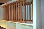 European oak plate rack installed in wall cupboard with mug storage under